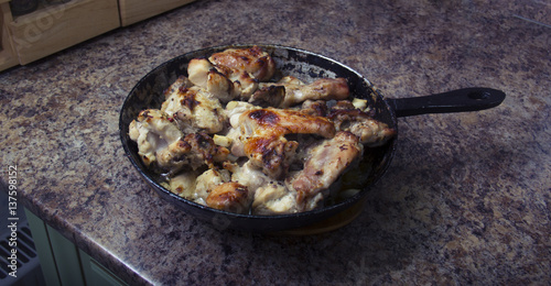 chicken in mustard sauce. chicken pieces in the pan. cooking. The finished dish