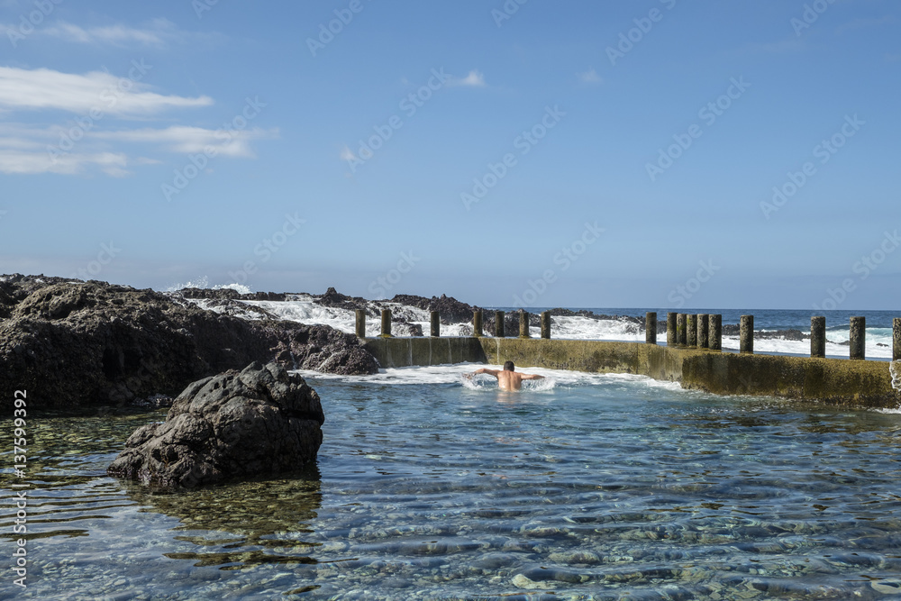 Alcala rock pool man swimming