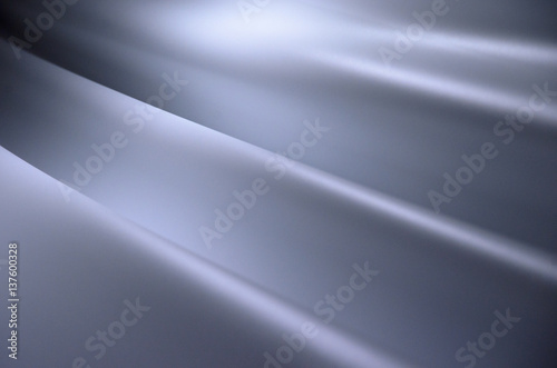 Smooth creases and folds on a fabric with lighting and shadows