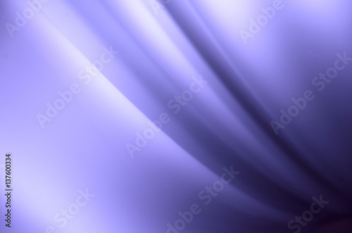 Smooth creases and folds on a cornflower fabric with lights and deep shadows