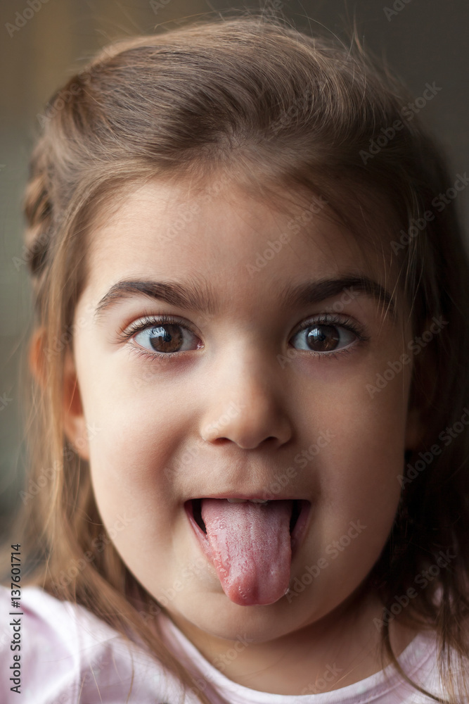girl with a tongue out girl with a tongue out