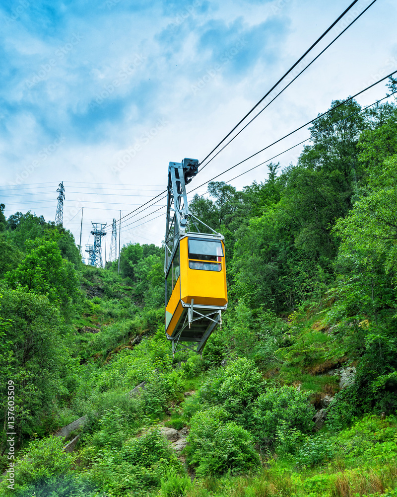 Cableway lift gondola cabins on mountains background beautiful scenery