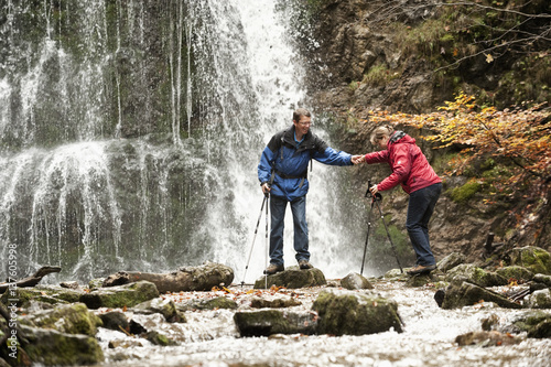 Couple In Front Of A Waterfall, Crossing Brook, Bavaria, Germany,  Europe