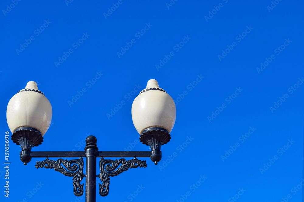Street lights against a blue sky day. Space for text. Street lights against a blue sky day. Space for text.