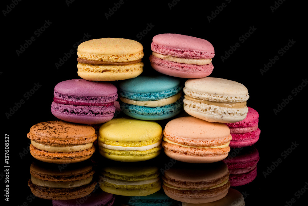 Colorful macaroon over black background