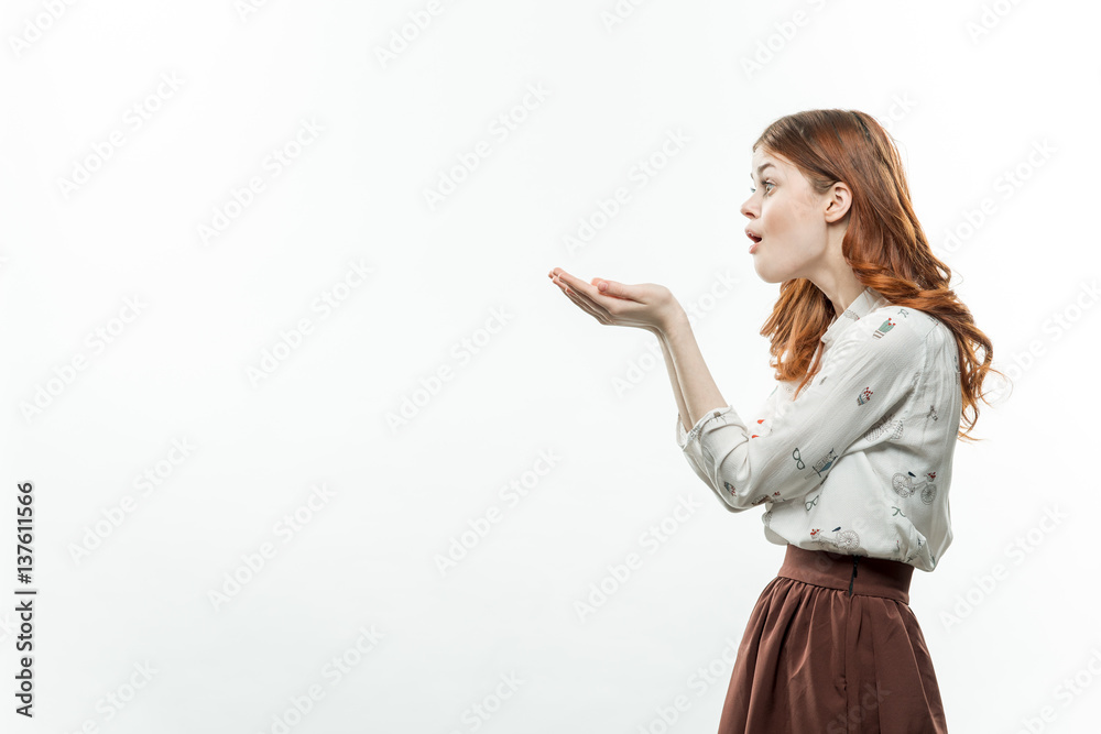 woman gesticulating with hands on a light background woman gesticulating with hands on a light background