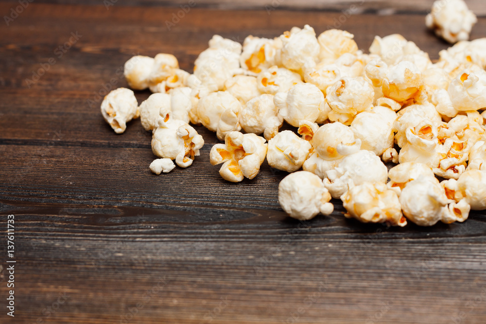 popcorn on a wooden table popcorn on a wooden table