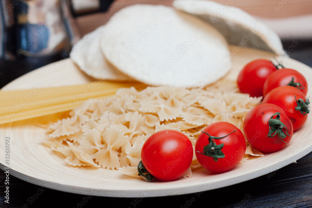 pasta of different kinds of cherry tomatoes on a plate pasta of different kinds of cherry tomatoes on a plate