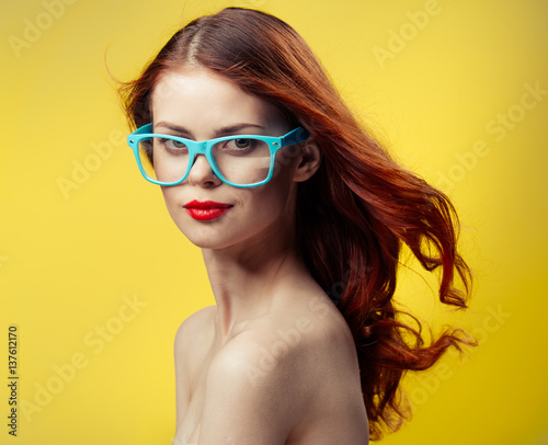 beautiful woman in blue glasses, red lips