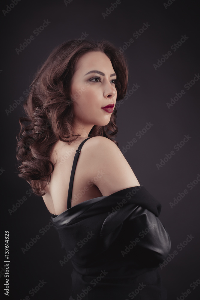Fototapeta premium Beautiful woman in lace lingerie and leather jacket