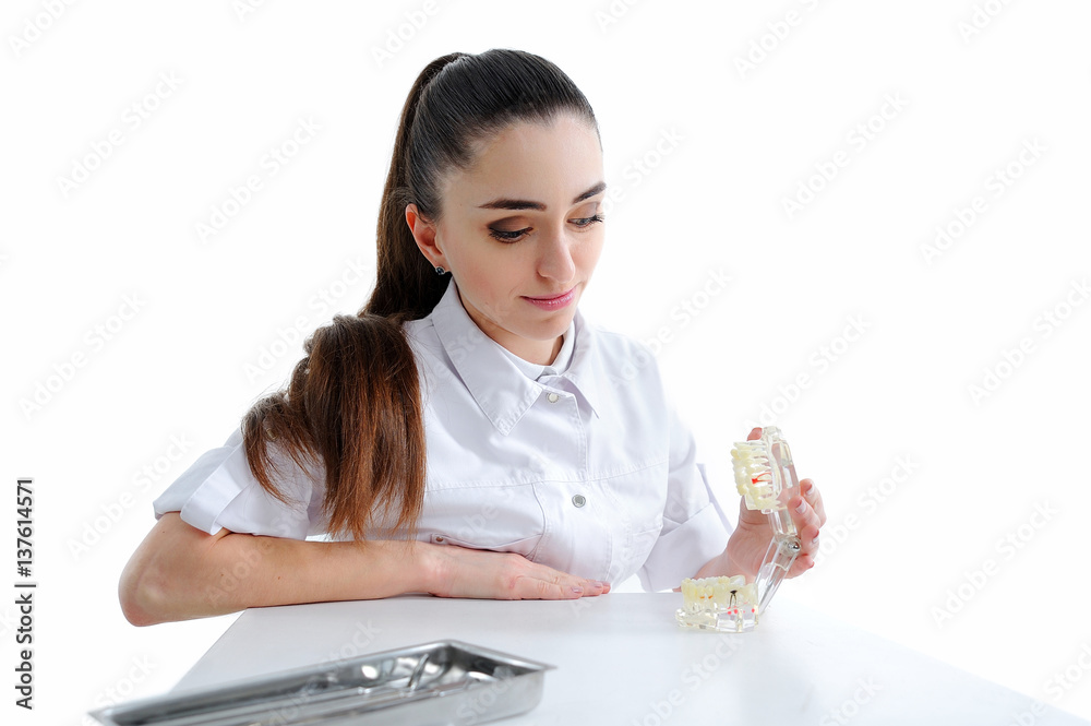 Dentist woman isolated on white with tools Dentist woman isolated on white with tools