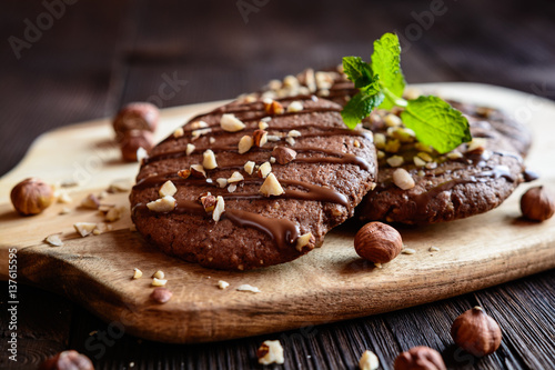 Konstfotografi Delicious chocolate cookies with hazelnuts and topping