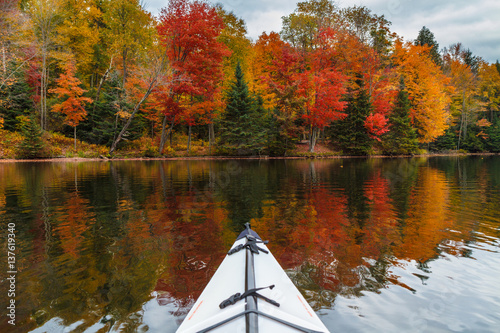 Kayaking in an autumn lake in upstate new york