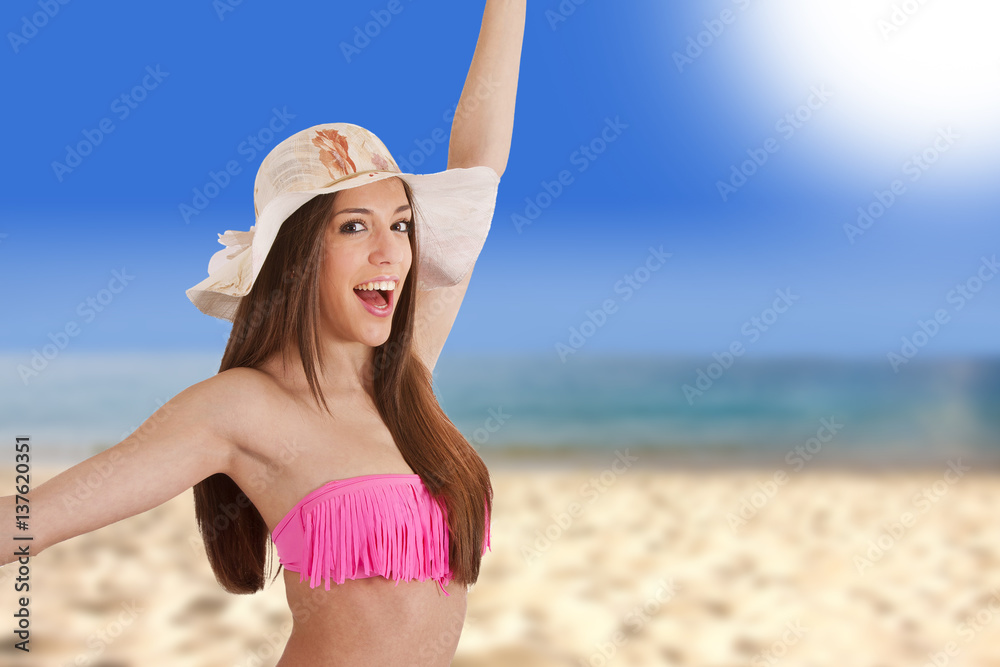 girl on the beach in sunny summer day