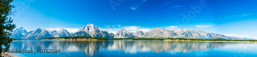 Grand Teton National Park, Wyoming. Panorama showing reflection of mountains on Jackson Lake near Yellowstone.