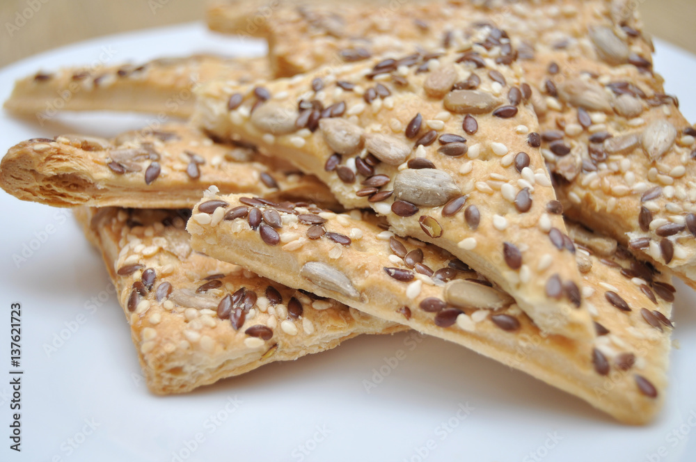 Flaky homemade cookies on a white plate Flaky homemade cookies on a white plate