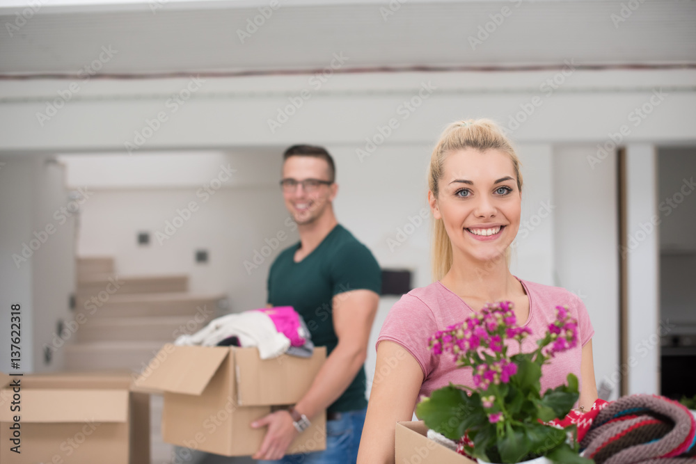 young couple moving into a new home young couple moving into a new home