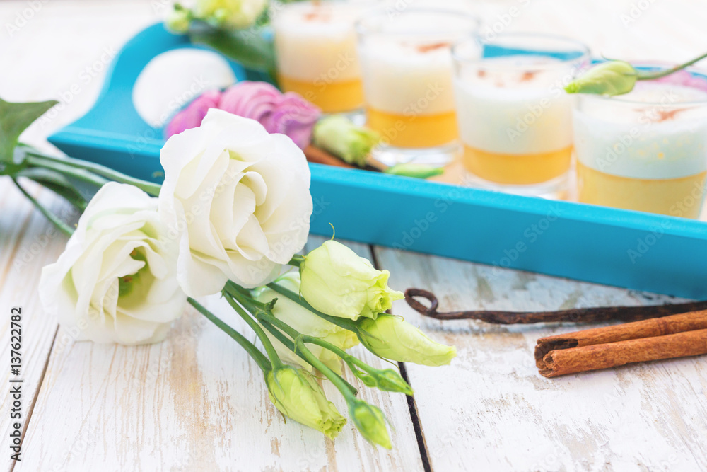 Eggnog, marshmallow dessert and white eustoma flowers. Easter concept Eggnog, marshmallow dessert and white eustoma flowers. Easter concept