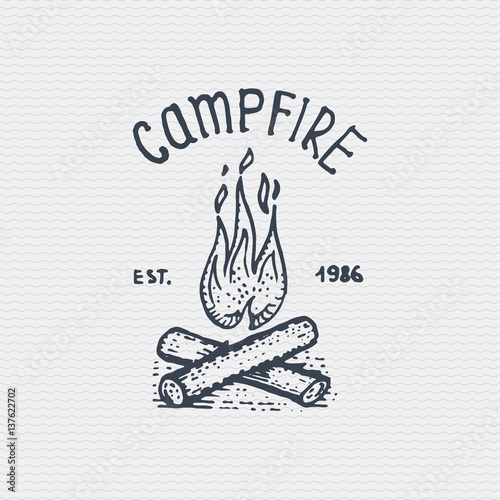 vintage old logo or badge, label engraved and old hand drawn style with campfire