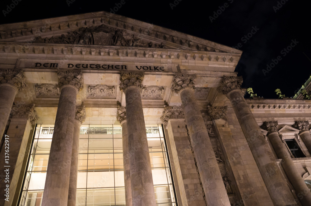 Nighttime close-up view of famous Reichstag building in Berlin, Germany
