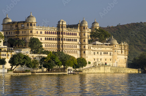Beautiful landscape of the city on water at sunset in India Udaipur 
