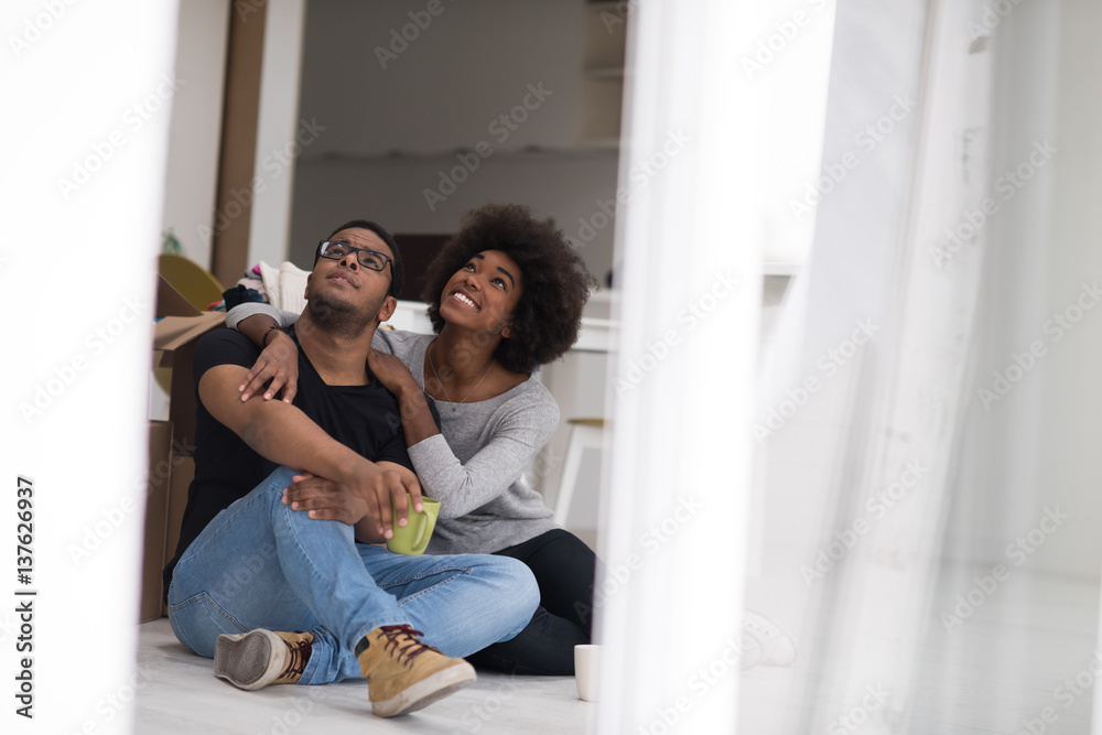 African American couple relaxing in new house African American couple relaxing in new house