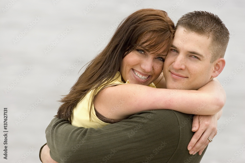 Couple share romantic moments on the beach. Couple share romantic moments on the beach.