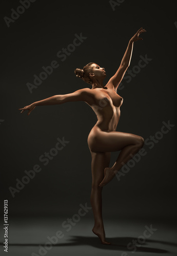 Gold skin nude woman artistic studio portrat