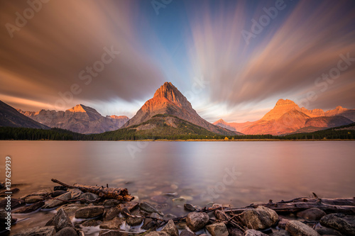 Mount Grinnell at Sunrise from the shores of Swiftcurrent Lake in Glacier National Park, Montana photo