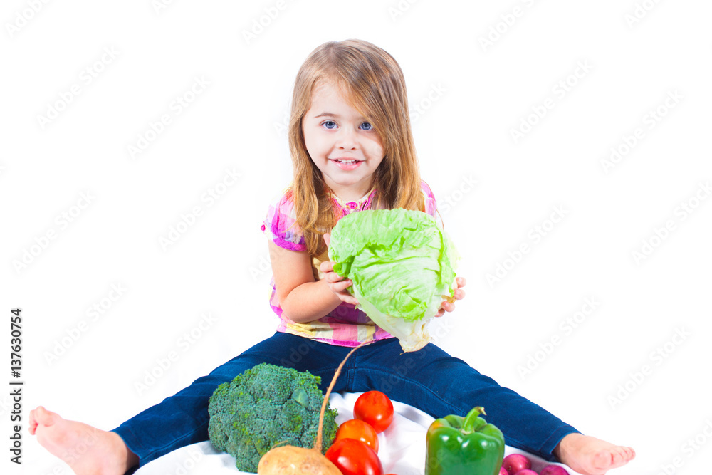 Pretty child with vegetables on white background Pretty child with vegetables on white background