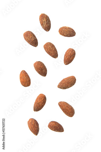 Almonds falling isolated on white background