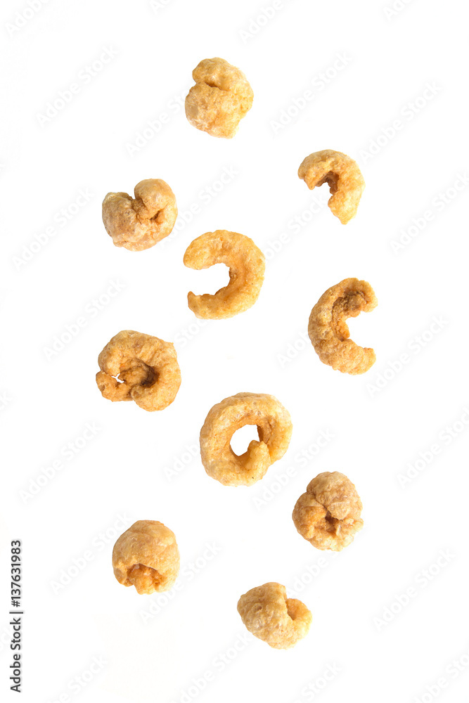 Falling pile of pork rind on white background. Falling pile of pork rind on white background.
