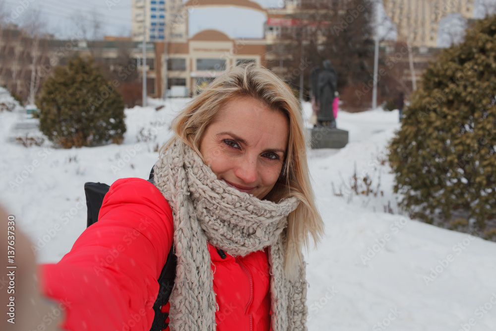 The girl in the winter in a red jacket The girl in the winter in a red jacket