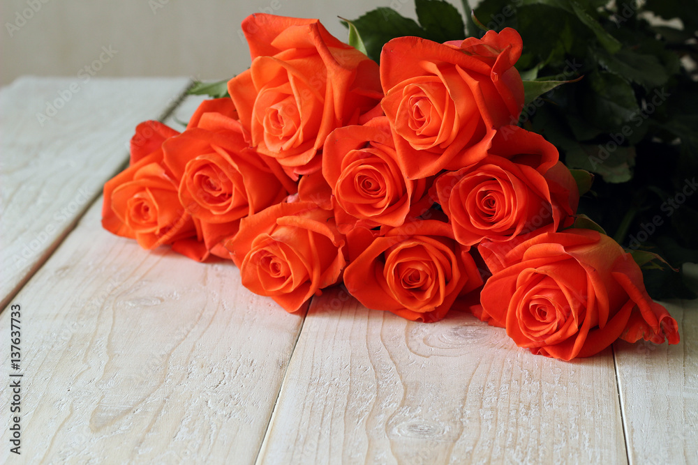 Bouquet of red roses on a wooden background Bouquet of red roses on a wooden background