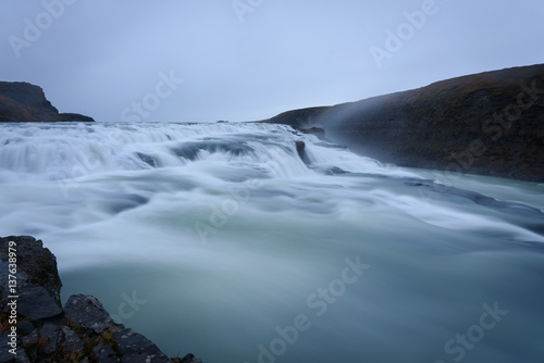 Smooth flowing water of turbulent Gullfoss waterfall