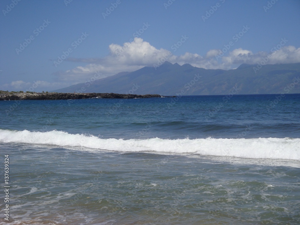 Distant Tropical island from Hawaiian beach