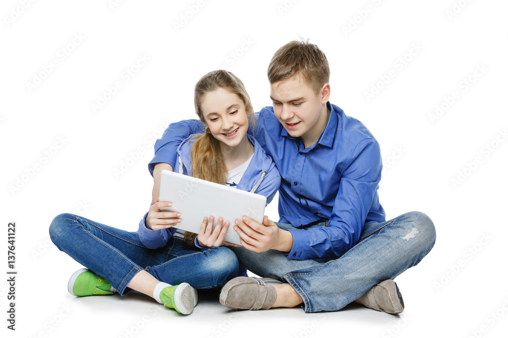 Teen age boy and girl with tablet Teen age boy and girl with tablet