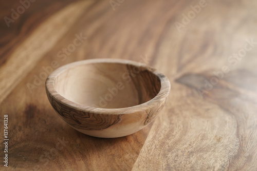 empty olive wood bowl on table
