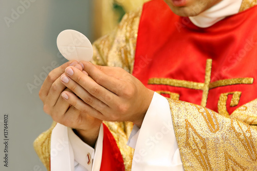 Priest celebrate mass at the church photo