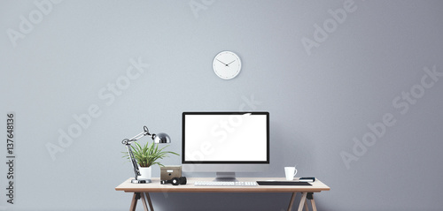 Computer display and office tools on desk. Desktop computer screen isolated. Modern creative workspace background. Front view photo