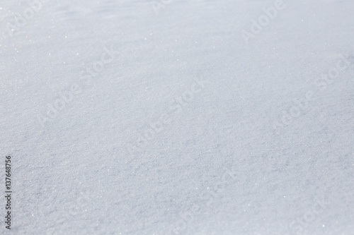 texture of snowdrifts in a soft diffused sunset light.