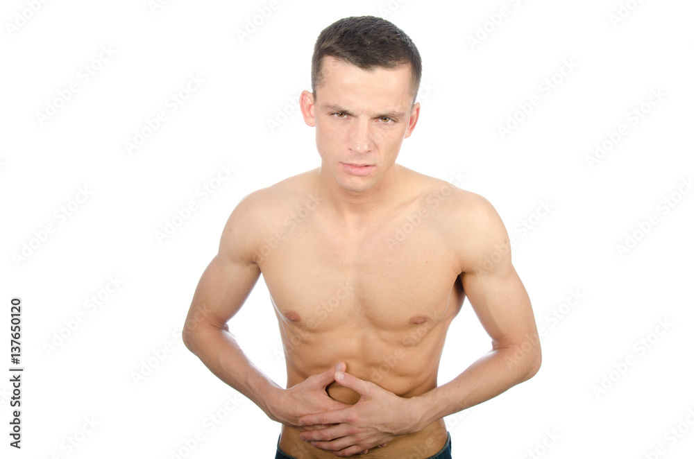 Young man shirtless and abdominal pain. Stomach problems.