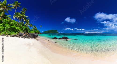 Panorama of Lalomanu beach on Samoa Island with coconut palm trees