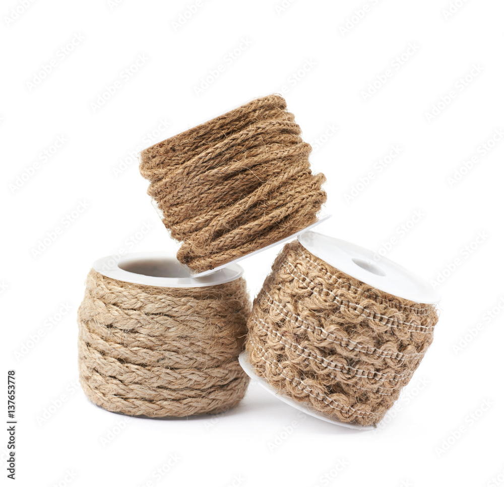 Pile of rope bobbins isolated