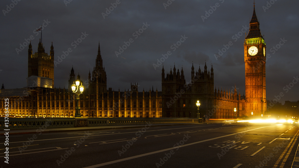 LONDON, UK - APRIL: Traffic and pedestrians on Westminster Bridge near Big Ben and Parliament