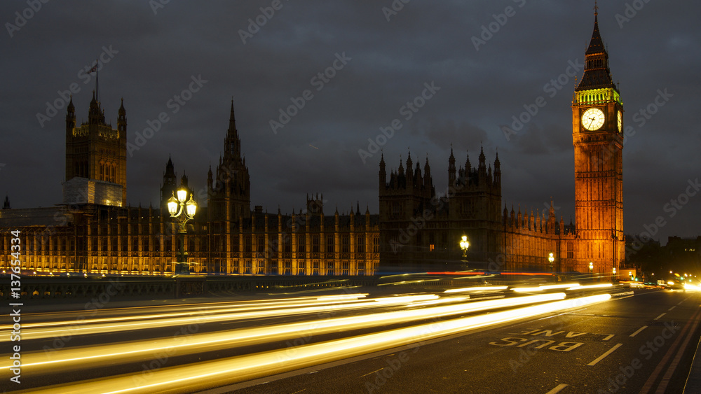 LONDON, UK - APRIL: Traffic and pedestrians on Westminster Bridge near Big Ben and Parliament