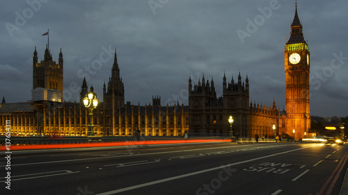 LONDON  UK - APRIL  Traffic and pedestrians on Westminster Bridge near Big Ben and Parliament
