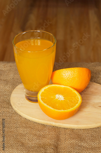half of orange juice and a glass top view