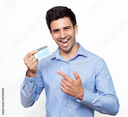 Emotional man pointing at credit card