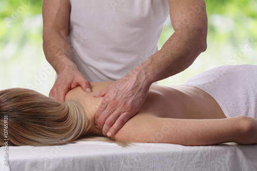 Young woman having massage. Relaxation, body care treatment, spa, wellness concept